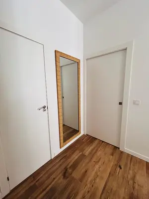 an empty room with a mirror and a door at Aires de Valencia in Valencia