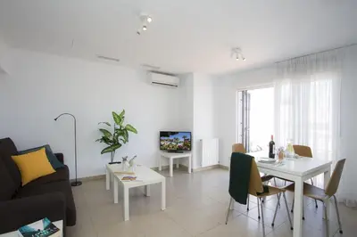 a living room with a couch and a table at SingularStays Mar44 Terrace in Valencia