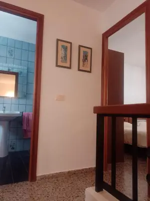 a bathroom with a mirror and a sink at Casa Numari in Caudiel