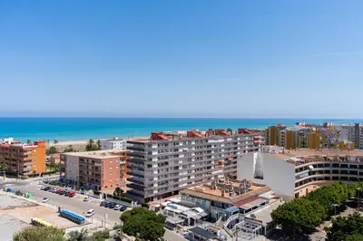 an aerial view of a city and the ocean at Seaview Apartment in Canet with Rooftop Pool in Canet de Berenguer