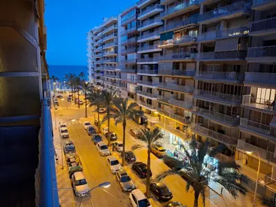 a view of a parking lot in front of a building at Cullera Mar Azul in Cullera