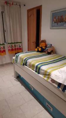 a bedroom with a bed with stuffed animals on it at valenia city in Valencia