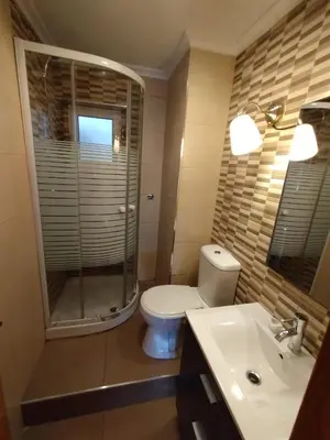 a bathroom with a toilet and a shower and a sink at valenia city in Valencia