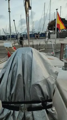 a boat with a cover on the side of a dock at Romantic sailboat in Valencia