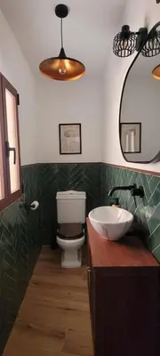 a bathroom with a sink and a toilet at Casa Los Yayos in Segorbe