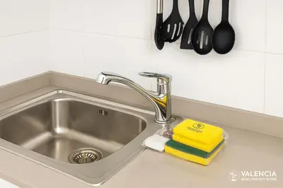 a kitchen sink with a sponge and a faucet at Valencia Beach Home 21 in Valencia