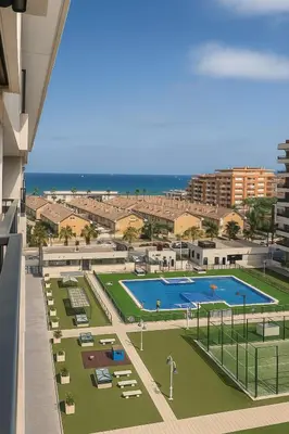 an overhead view of a tennis court with the beach at Valencia Beach Home 21 in Valencia
