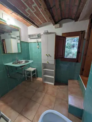 a bathroom with a sink and a toilet at Casa rural El Mestre in Alcudia de Veo