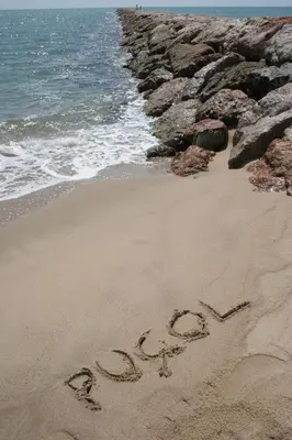 a word written in the sand on a beach at Hotel Alba in Puzol