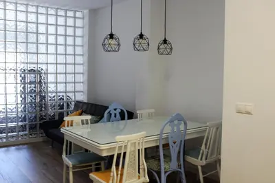 a dining room with a table and chairs at Playa Cabañyal - Diseño Mediterraneo in Valencia