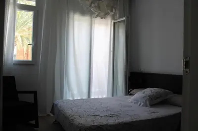 a bedroom with a bed in front of a window at Playa Cabañyal - Diseño Mediterraneo in Valencia