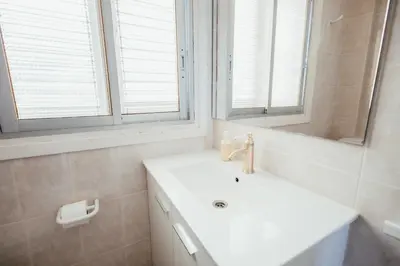 a white bathroom with a sink and a mirror at Garden at 50m from beach, ChillOut, Large Porche in Mareny Blau