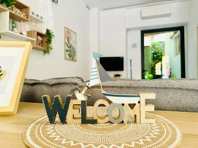 a wooden sign that saysweekly on a floor in a living room at Cute & Cozy Aparment Near The Historic Center in Valencia