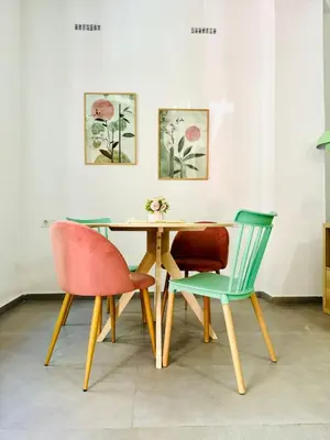 two chairs and a wooden table in a room at Cute & Cozy Aparment Near The Historic Center in Valencia