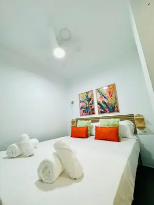 a bedroom with two beds with towels on them at Cute & Cozy Aparment Near The Historic Center in Valencia