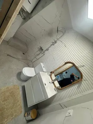 an overhead view of a bathroom with a toilet at Mínimal chic apartament in Puerto de Sagunto