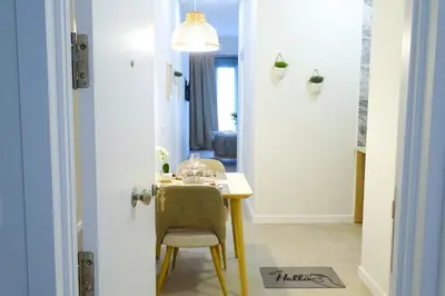 a dining room with a table and a chair at PTZ 1B - Loft Valencia in Valencia
