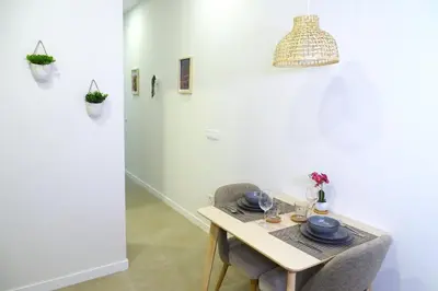 a dining room with a table and a chandelier at PTZ 1B - Loft Valencia in Valencia