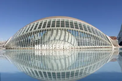 a large building with its reflection in the water at PTZ 2 - Loft Valencia in Valencia