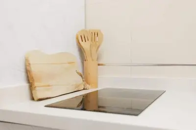 a counter with a cutting board and a knife and fork at Tiny Valencia Gem - 2BR - Relax in Valencia