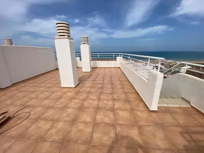 a balcony with a view of the ocean at Perla III Solo Familias Serviplaya in Casas Las Basas