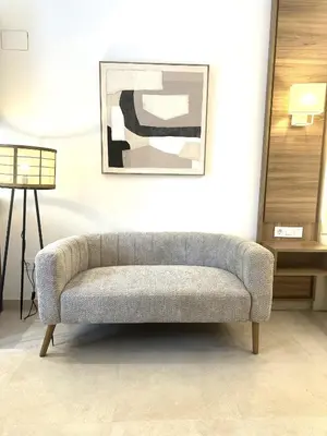 a couch in a living room with a picture on the wall at Marina Azura in Valencia