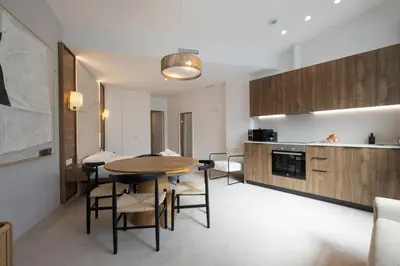 a kitchen and dining room with a table and chairs at Marina Azura in Valencia