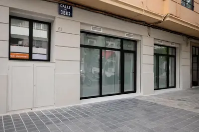 a building with doors and windows on a street at Olmaya Flats Valencia in Valencia