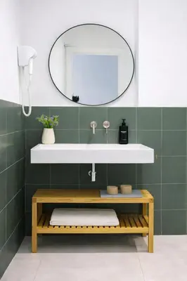 a bathroom with a sink and a mirror at Olmaya Flats Valencia in Valencia