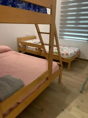 a bedroom with two bunk beds and a window at Apartamento El Atardecer in El Perelló