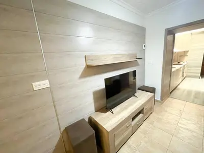 a living room with a flat screen tv on a wall at Casa Burriana con sauna in Burriana