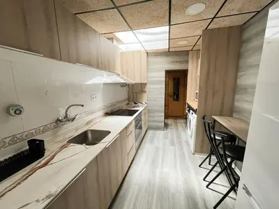 a kitchen with a sink and a counter top at Casa Burriana con sauna in Burriana