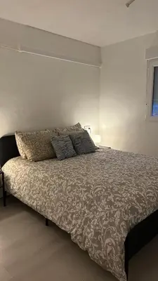 a bed in a white room with a large bed at Chalet con piscina dogfriendly in Algar de Palancia