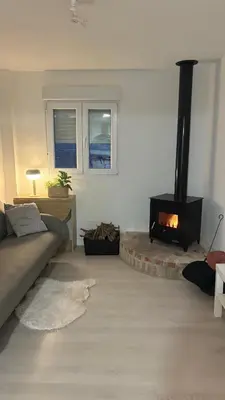 a living room with a couch and a fireplace at Chalet con piscina dogfriendly in Algar de Palancia