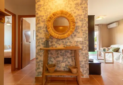 a bathroom with a mirror on a wall at Global Vacacional, Planta baja con piscina en Almenara in Almenara