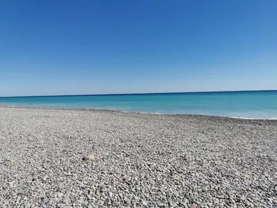 a rocky beach with the ocean in the background at Global Vacacional, Planta baja con piscina en Almenara in Almenara