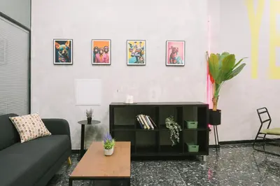 a living room with a couch and a table at U-nit Hostel Central Park in Valencia