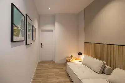 a living room with a couch and a table at Rubio Rooms by Concept in Valencia