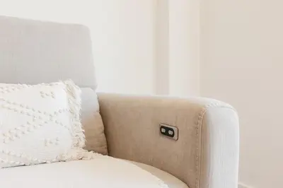 a beige couch with a pillow on it at Premium, Lux & Comfort by the Sea in Valencia
