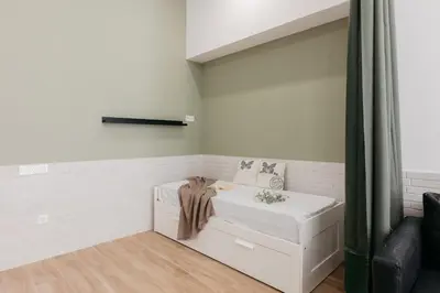 a bathroom with a white tub in a room at New! Comfort and Style Steps from Everything in Valencia