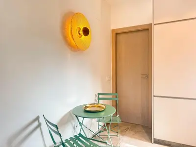 a room with a table and two chairs and a door at Piscina & Espacio & Confort entre Playa y Montaña in San Antonio de Banageber
