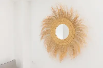 a wreath with a mirror hanging on a wall at Comfort & Charm in the Center in Valencia