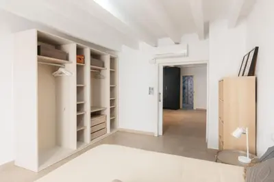 a room with white walls and white shelves at Comfort & Charm in the Center in Valencia