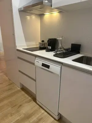 a kitchen with a sink and a stove top oven at Valencia Breeze in Alaquas