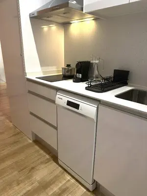 a white kitchen with a sink and a stove at Valencia Breeze in Alaquas