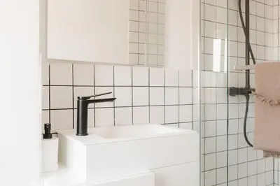 a white bathroom with a sink and a mirror at Penthouse with Terrace 2 Bedrooms 2 Bathrooms in Valencia