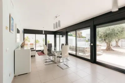a dining room with a table and chairs at Grand Villa with Pool in Sagunto