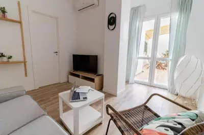 a living room with a couch and a table at Super Apto 2habitaciones dobles 4 pax wifi terraza in Valencia