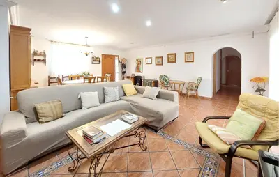 a living room with a couch and a table at Awesome Home In Bétera in Bétera