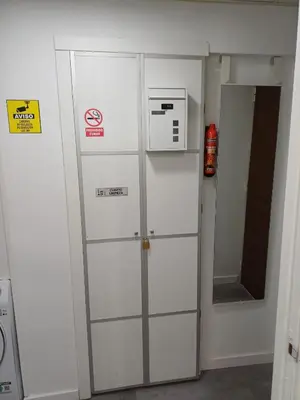 a white refrigerator in a room with a microwave at loft cerca del centro de Valencia in Valencia